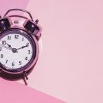 clock-on-a-pink-background