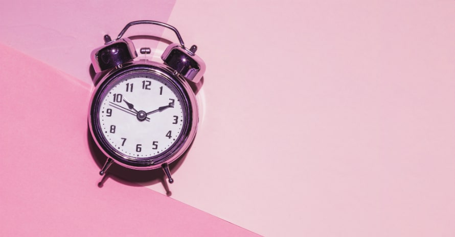 clock-on-a-pink-background