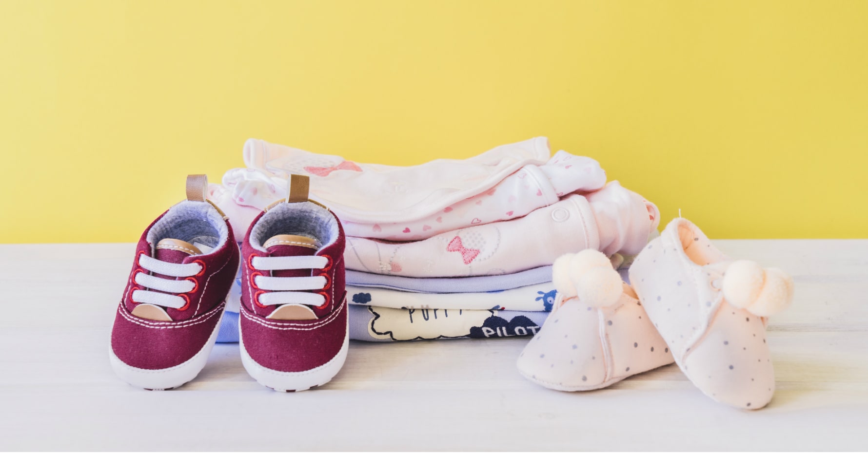 some baby clothes on the table