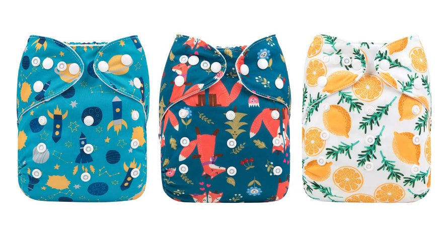 three cloth diapers with a funny print
