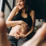 pregnant-woman-sitting-by-window