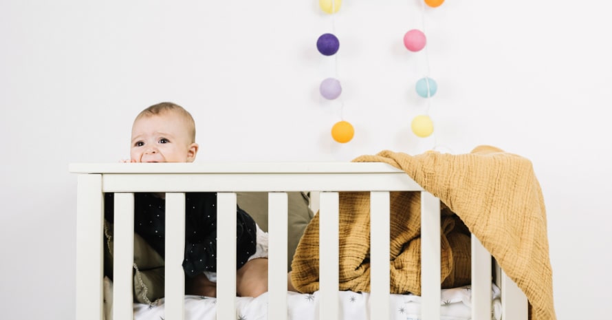 cute baby in the crib white background