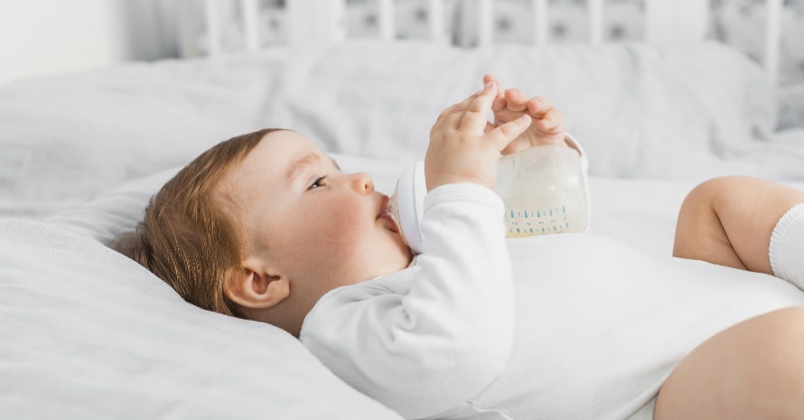 baby drinking milk from the bottle