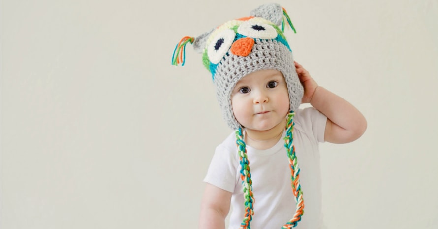 baby in wicker hat